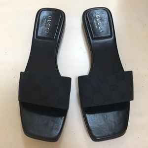 Authentic never worn Gucci slides. Black GG canvas